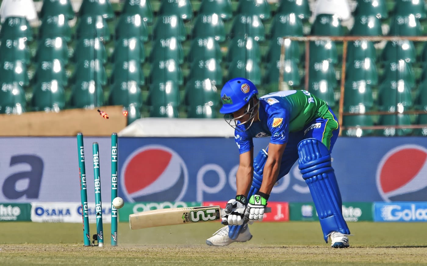 Rohail Nazir fails to keep a yorker out, batsman in action cricket photo