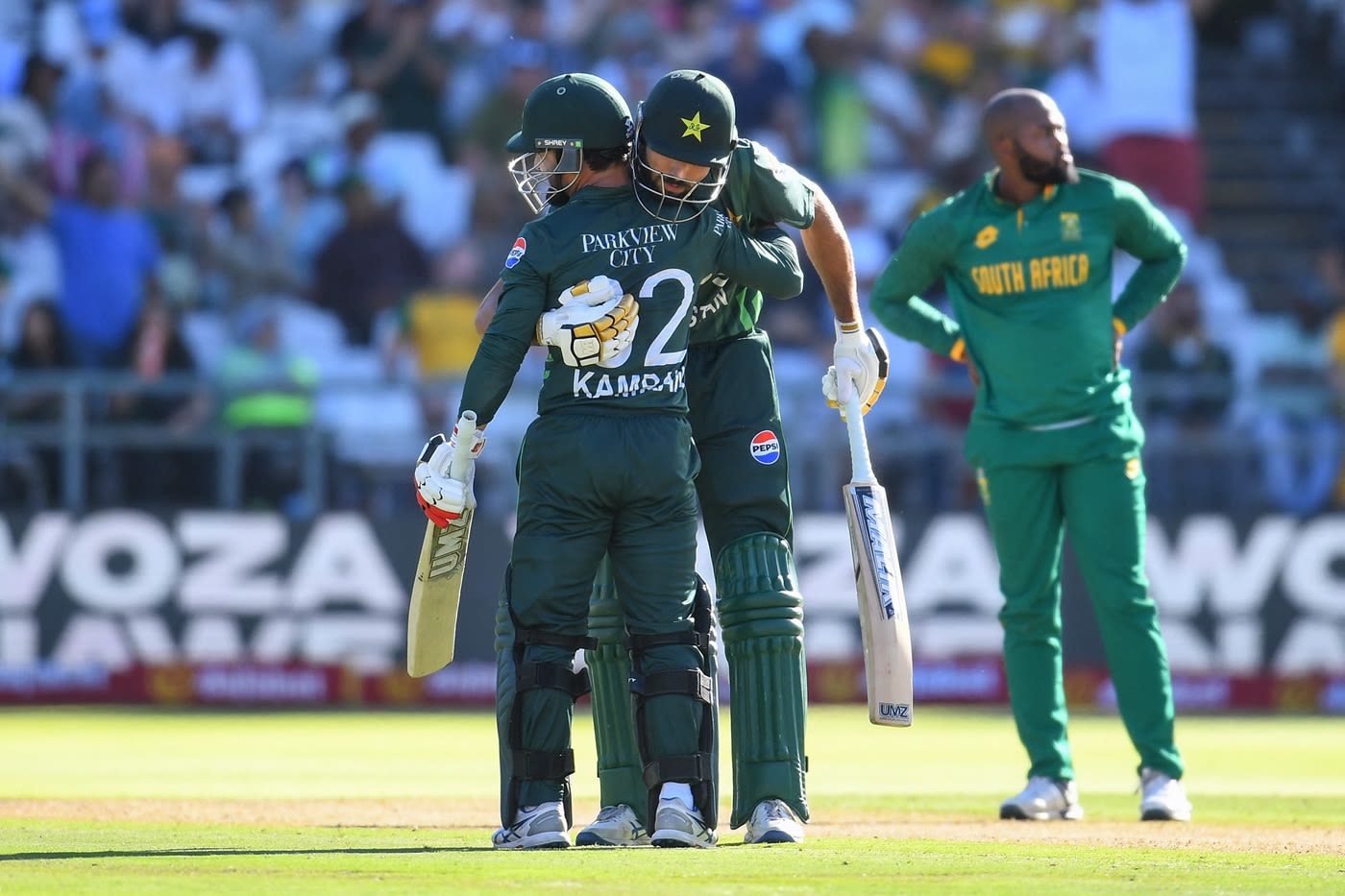 Kamran Ghulam is congratulated by Irfan Khan after his 25-ball fifty, cricket celebration hd pics