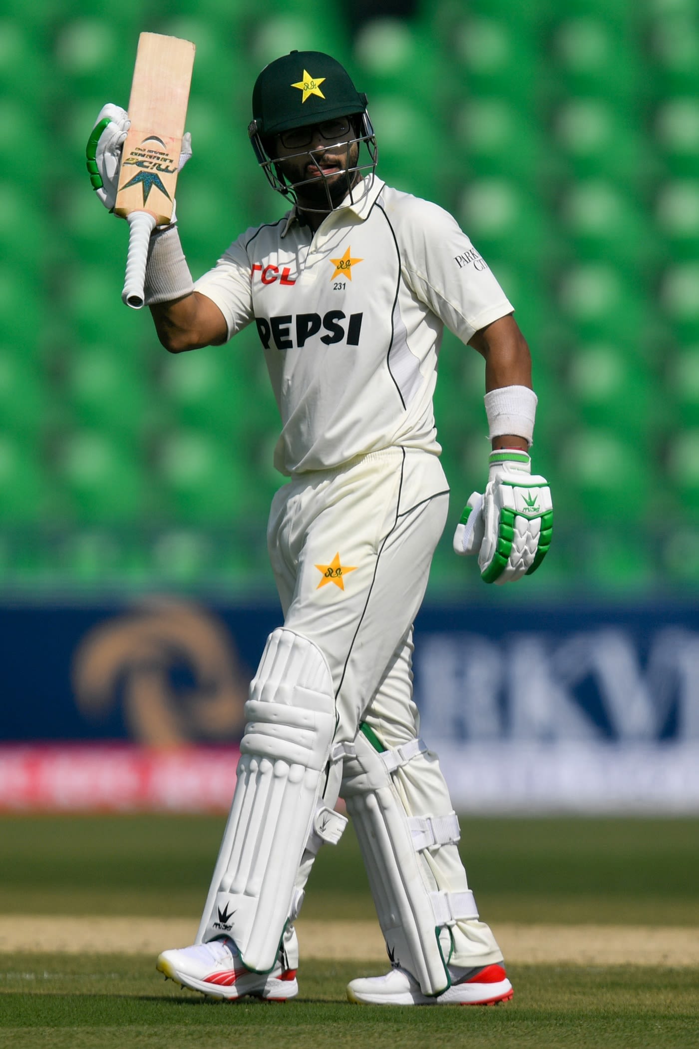 Imam-ul-Haq raises his bat after reaching a fifty, batsman celebration photo