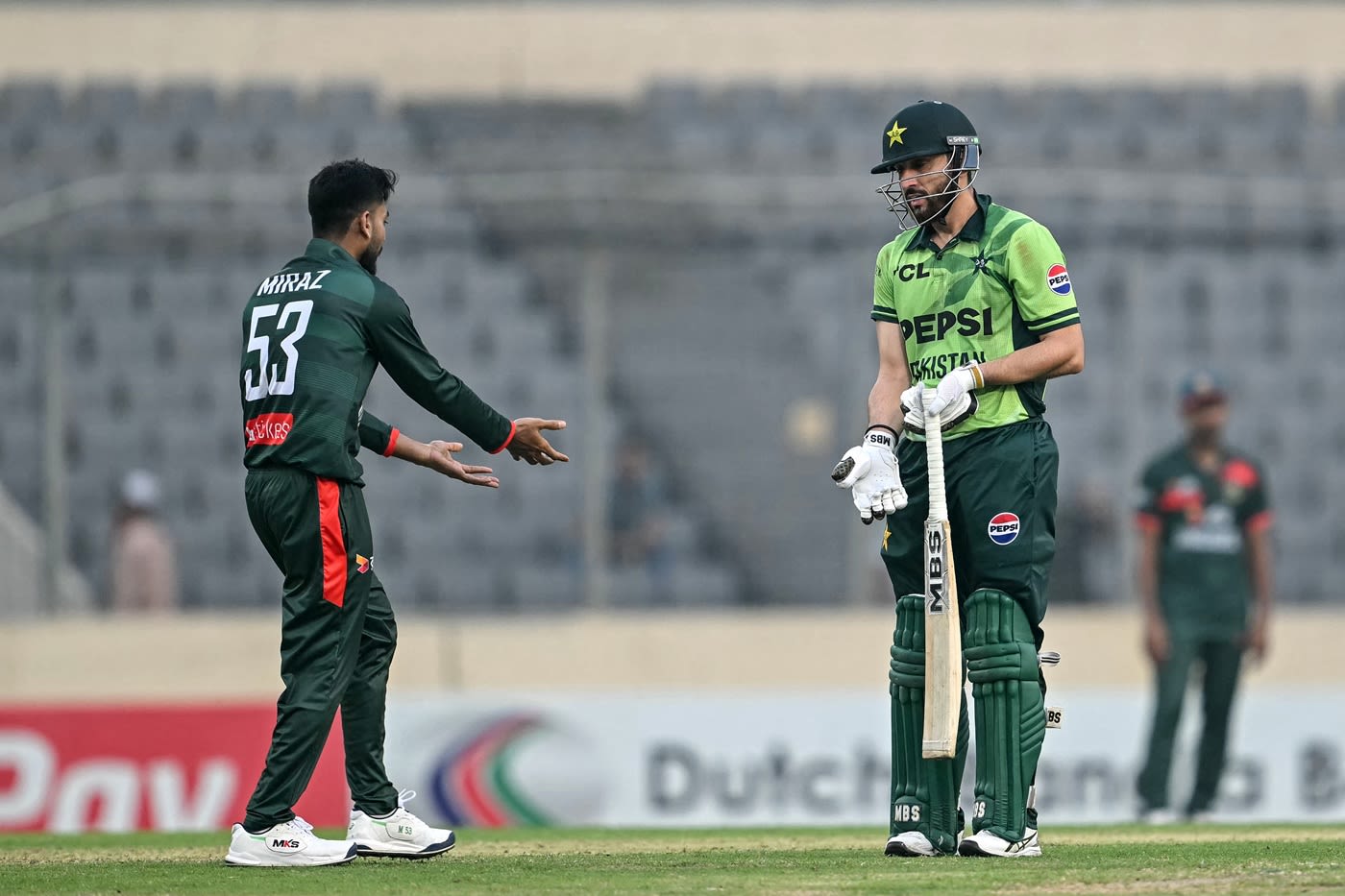 Mehidy Hasan Miraz and Salman Agha argue after the latter's dismissal, cricket argument photo