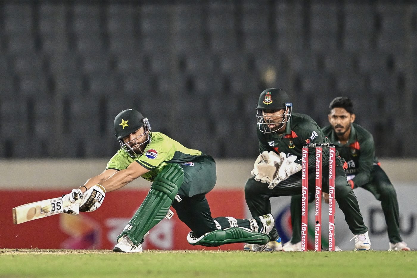 Salman Ali Agha rolls out a sweep, cricket batting pic, hd pics