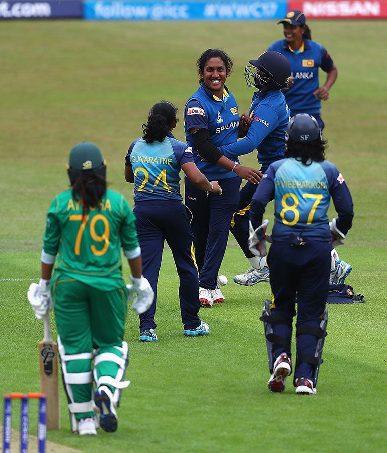 Chandima Gunaratne celebrates with her team-mates after dismissing Ayesha Zafar