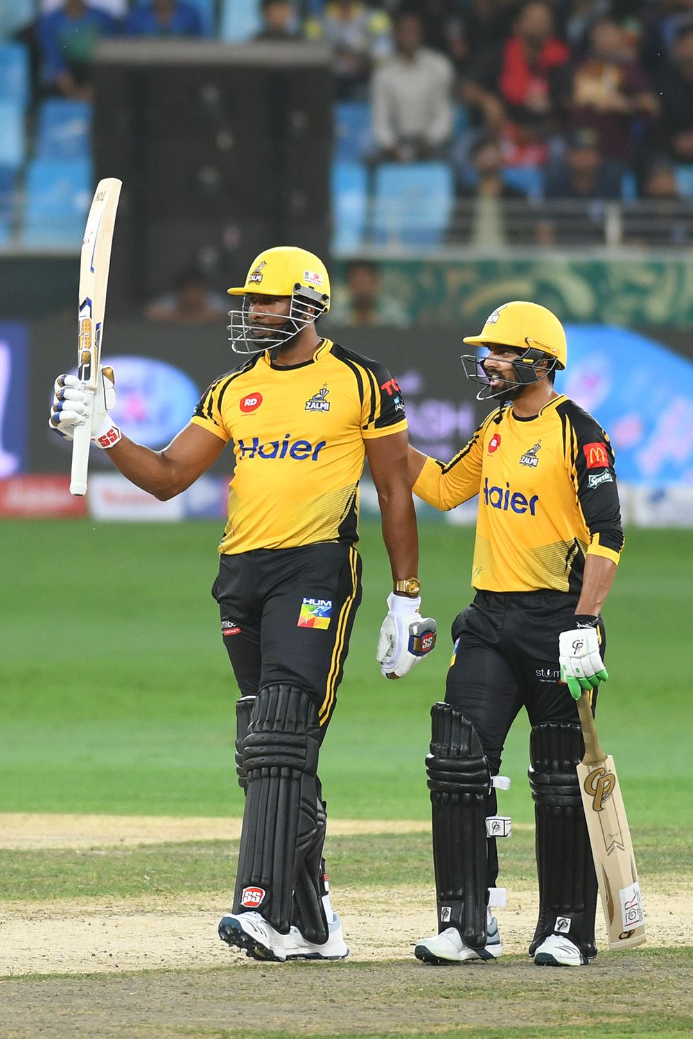 Kieron Pollard and Umar Amin hit unbeaten half-centuries