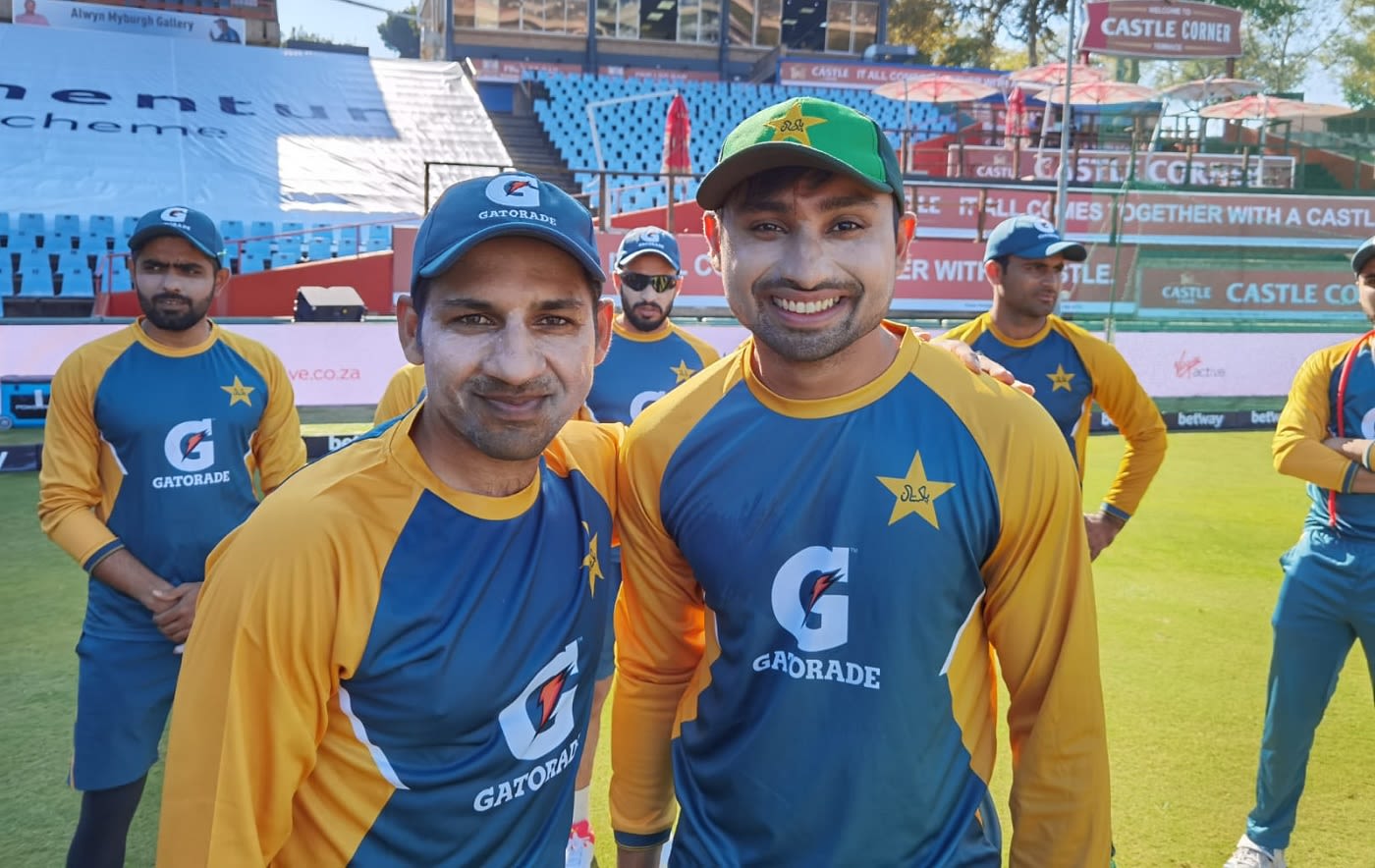 Danish Aziz poses with Sarfaraz Ahmed after earning his maiden international cap