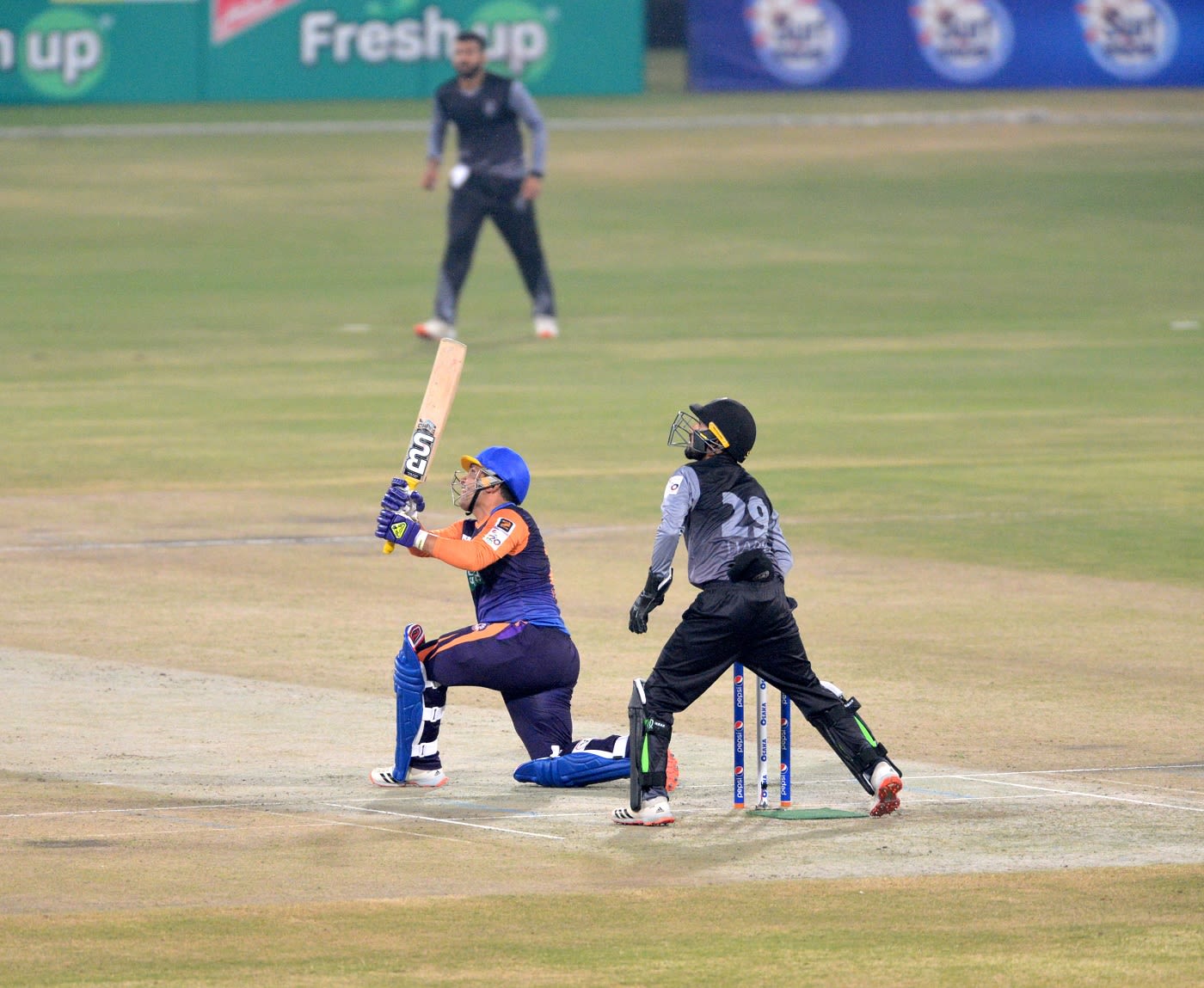 Kamran Akmal sweeps one during his knock of 42