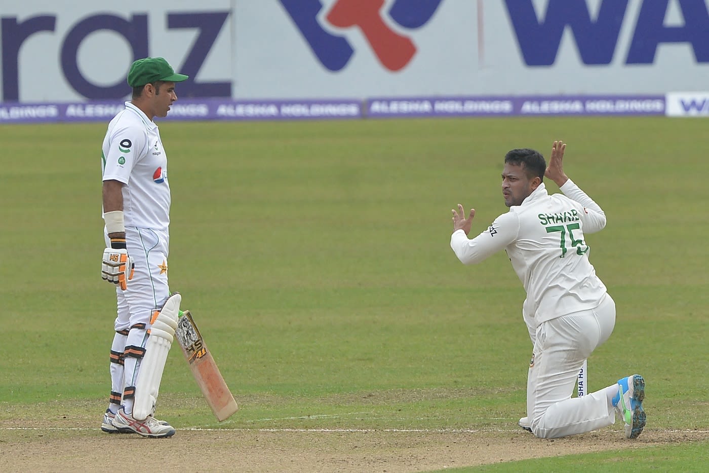 Shakib Al Hasan reacts as Abid Ali looks on