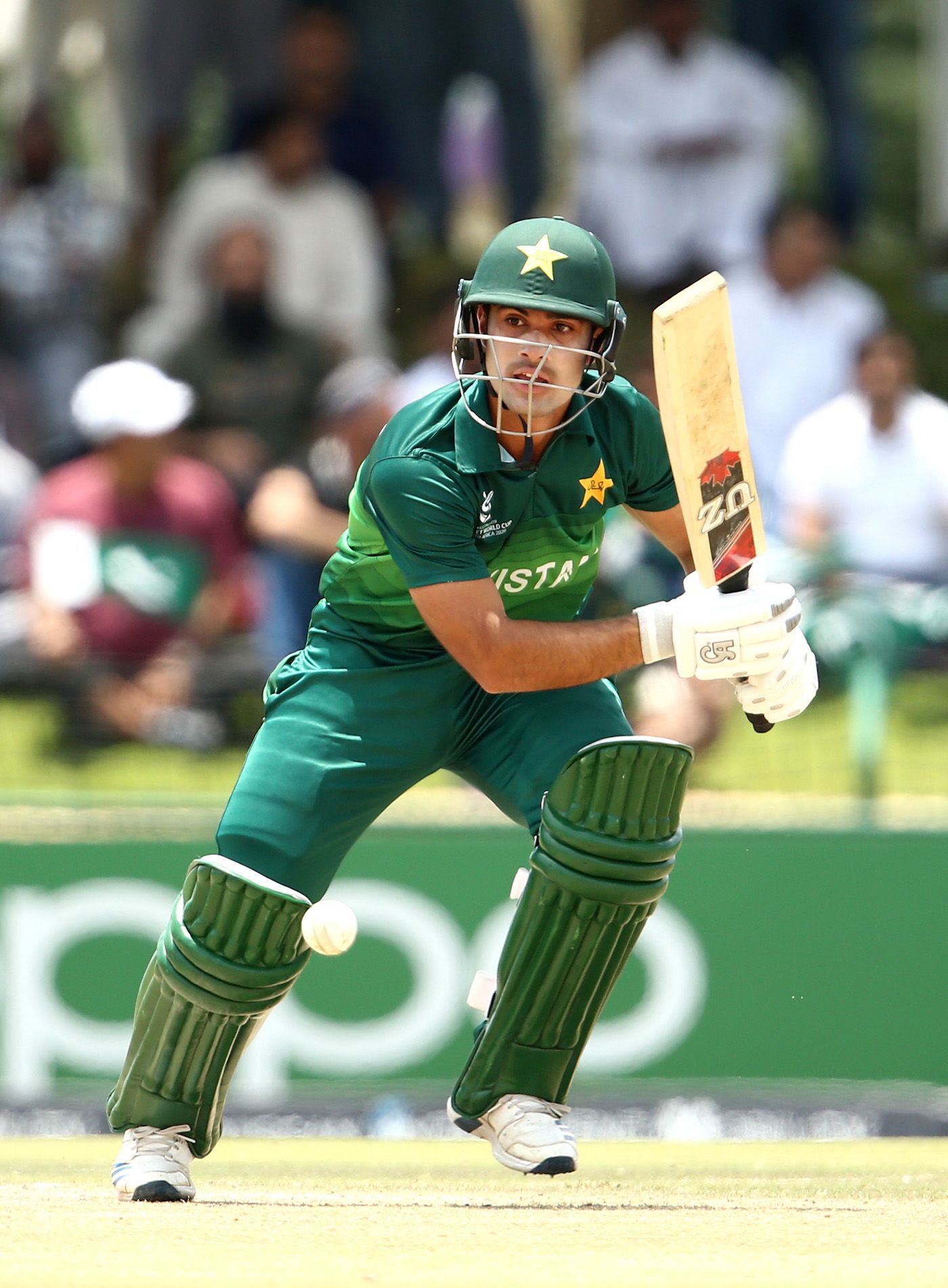Qasim Akram guides the ball towards point