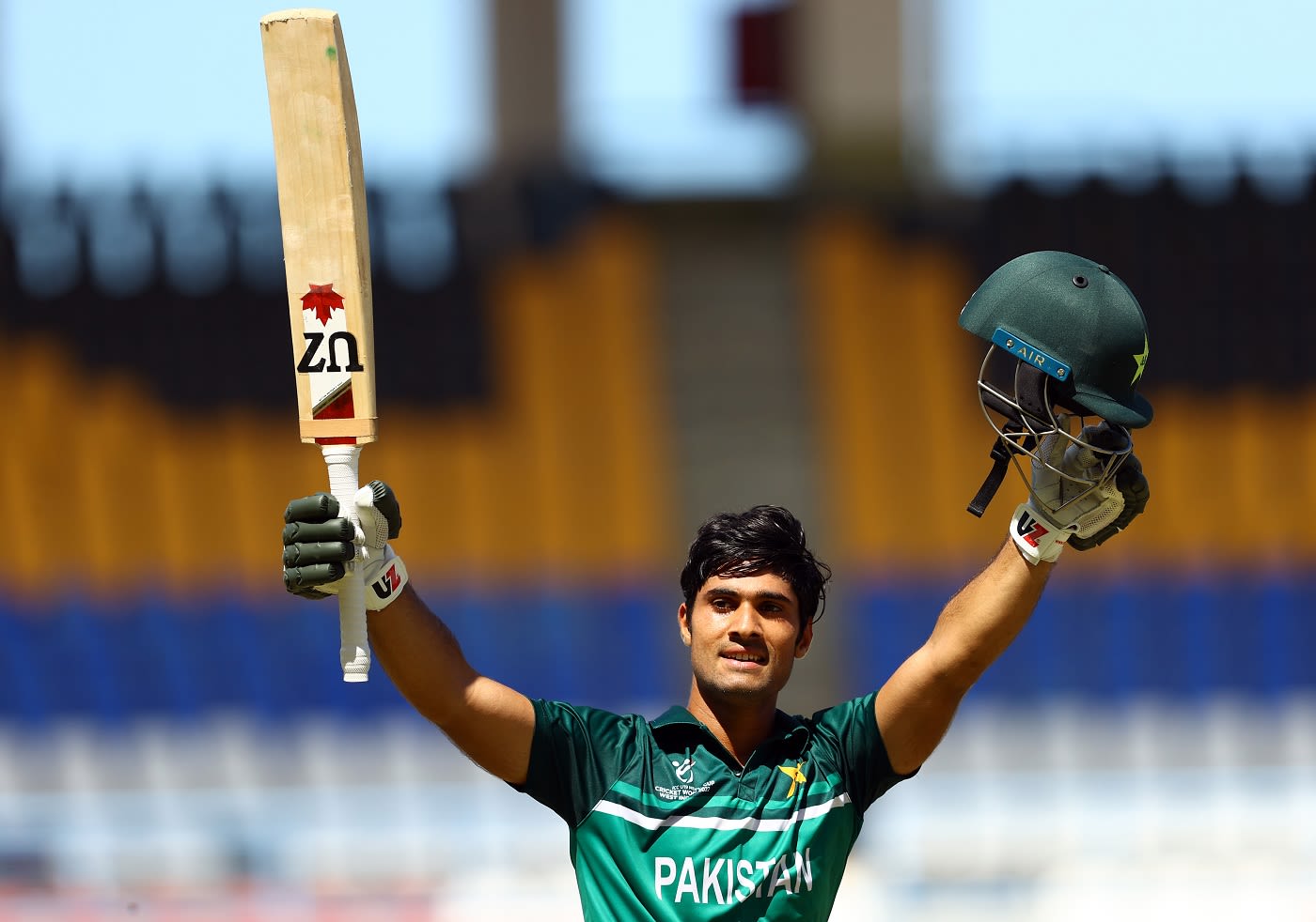 Qasim Akram celebrates a century