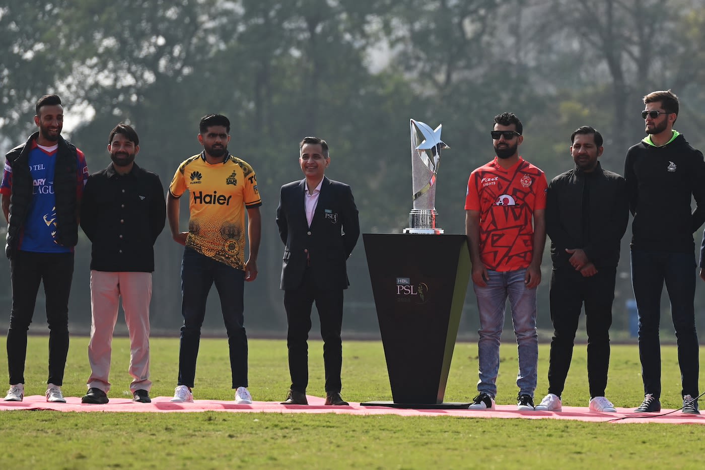 The six captains pose with the PSL trophy