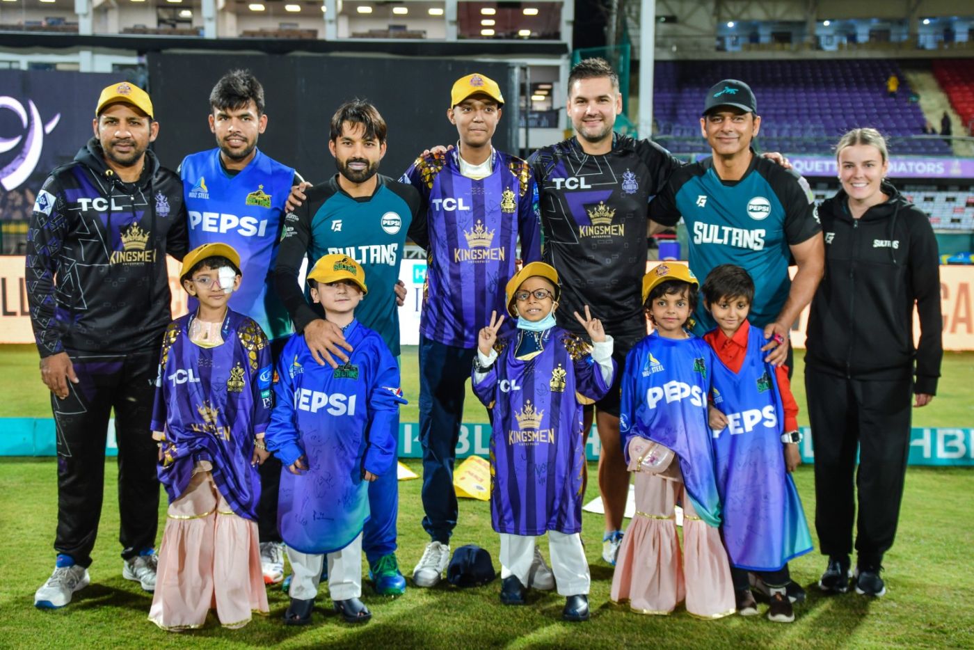 Players and their special guests strike a pose on Gold Ribbon Day in Karachi, a bid by the PCB to raise awareness on childhood cancers