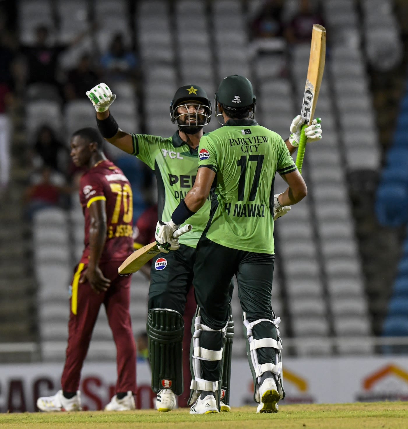 Hussain Talat and Hasan Nawaz celebrate after finishing the job