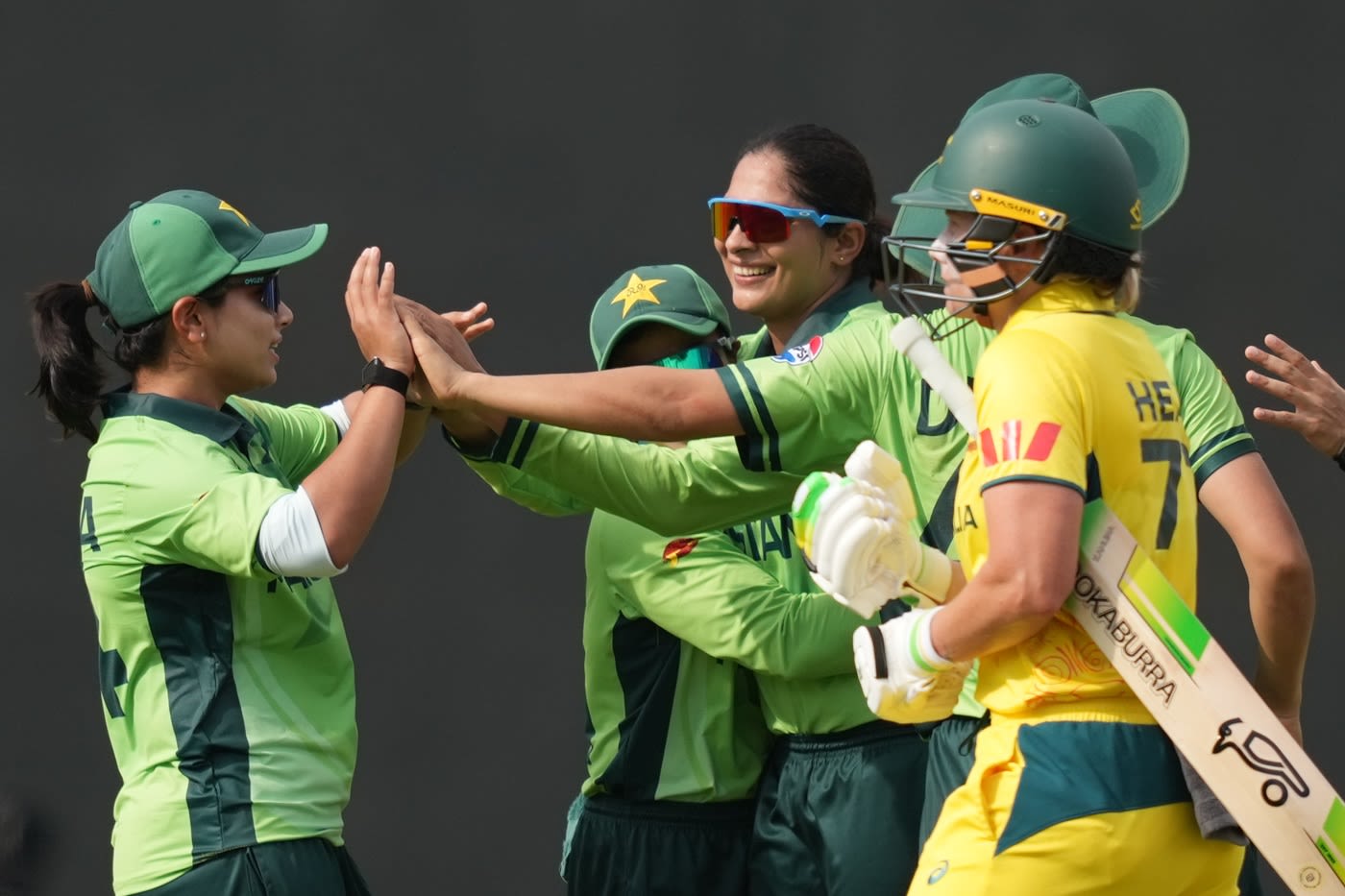 Sadia Iqbal celebrates the wicket of Alyssa Healy
