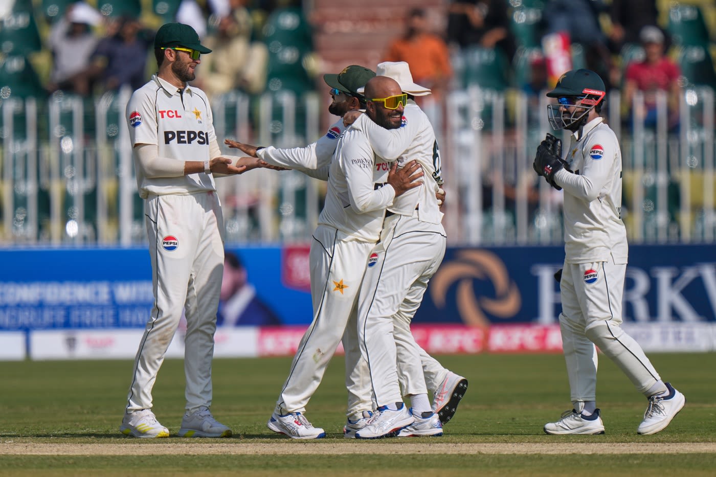 Sajid Khan is swamped by his team-mates after he dismissed Aiden Markram