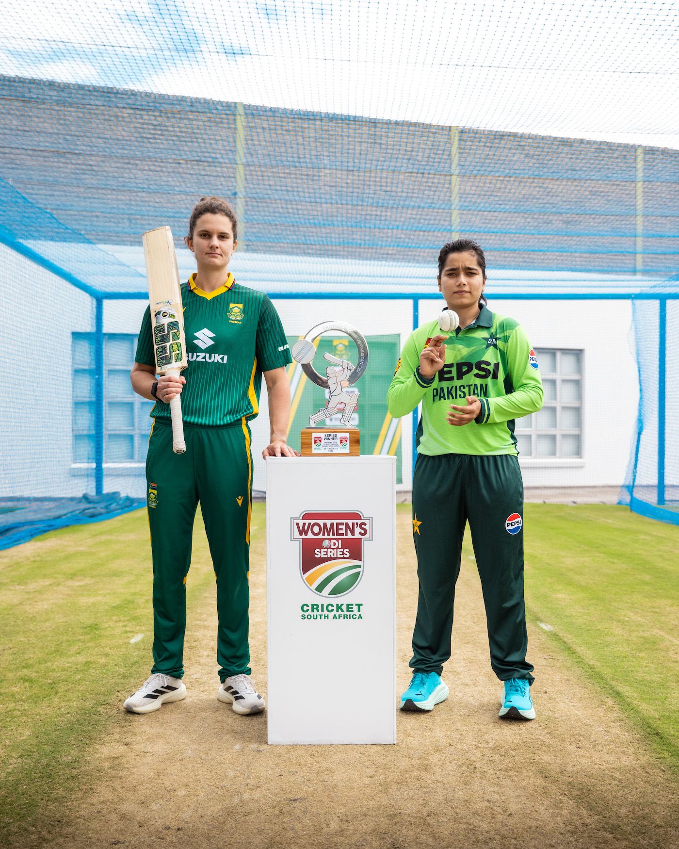 Laura Wolvaardt and Fatima Sana pose with the ODI-series trophy