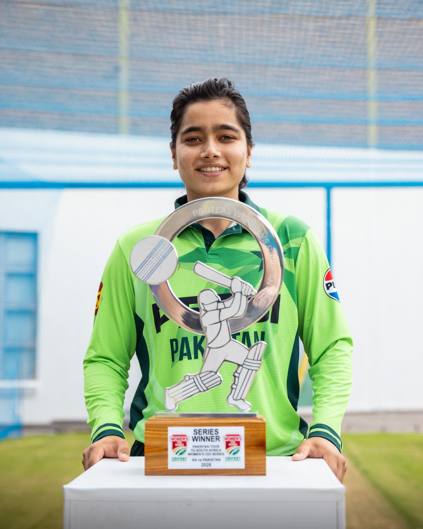 Fatima Sana poses with the ODI-series trophy